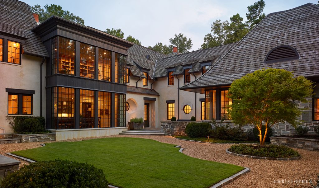 Light Filled French Normandy Courtyard Entrance with Two Story Windows